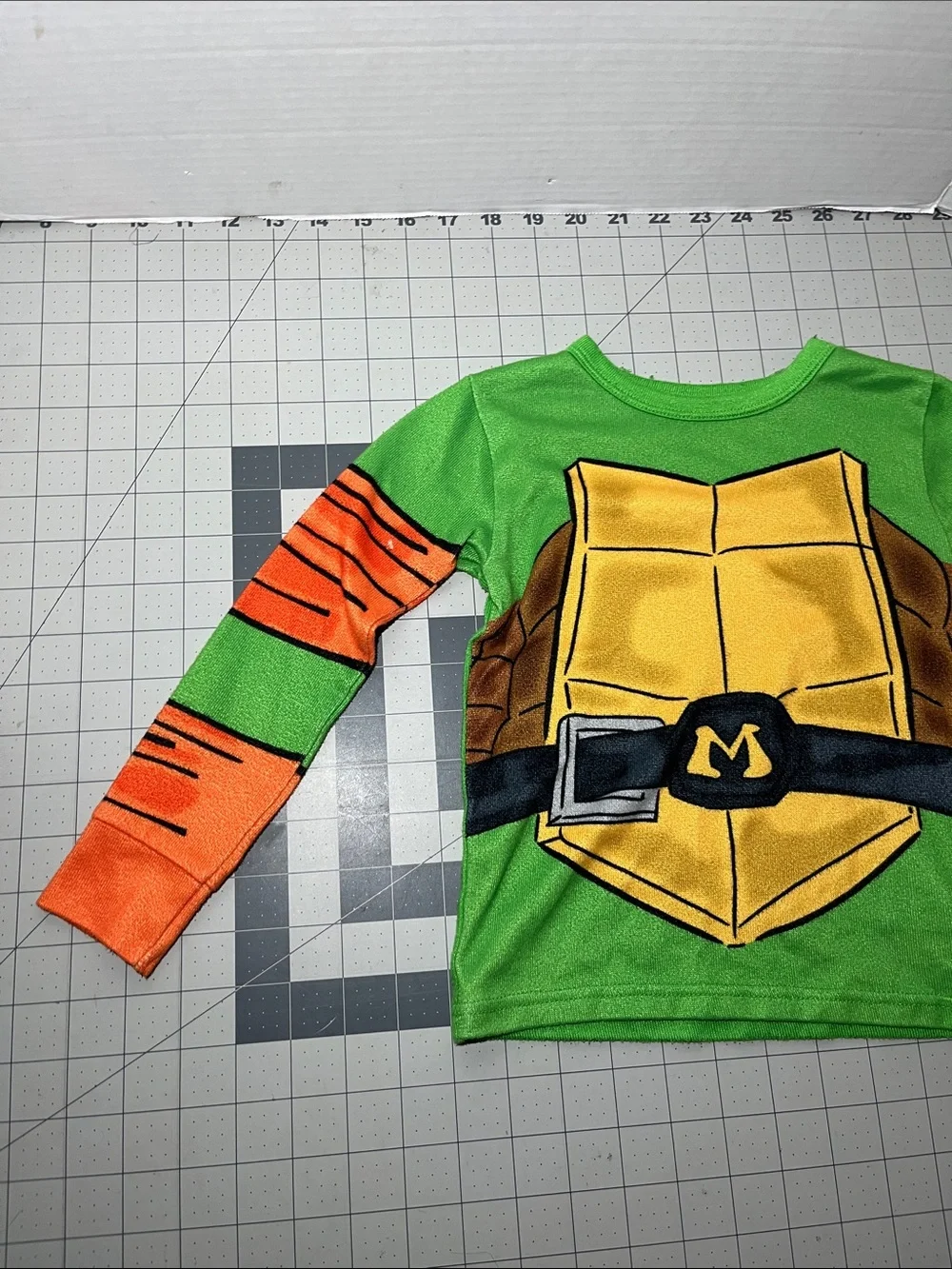 Kids Green Turtle Shell Pajama Top with Orange Sleeve Accents